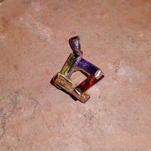 Four stone pendant in marked sterling silver